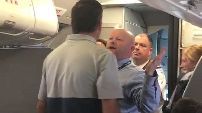 American Airlines Flight Attendant Challenges Passenger Into Fight