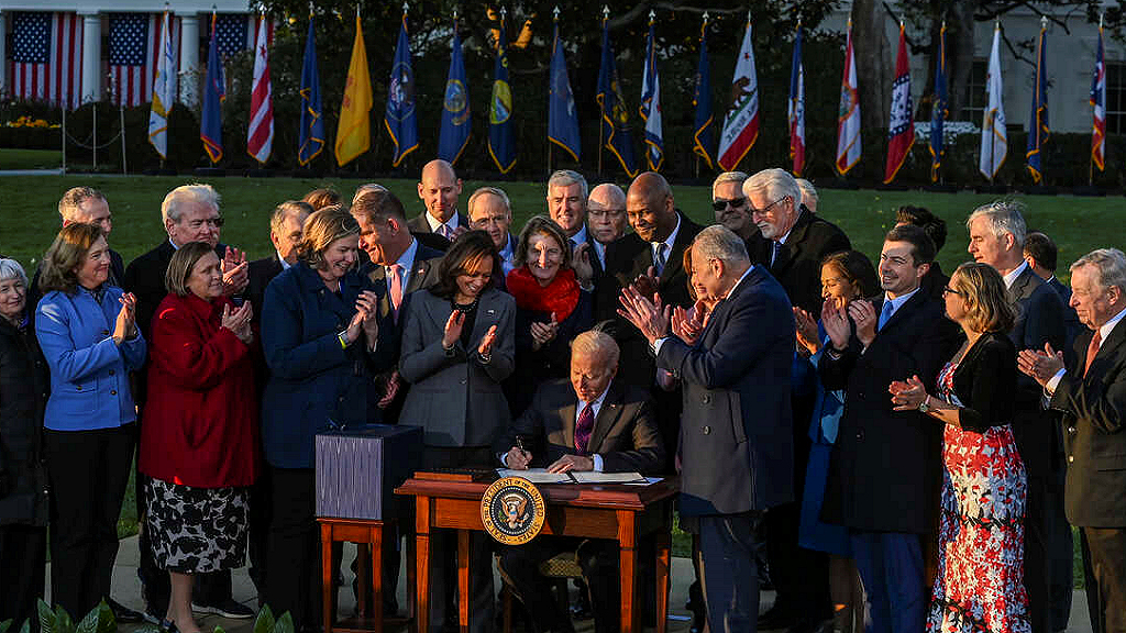 President Joe Biden signs infrastructure bill into law on 11/15/21. Image credit, Getty Images. 